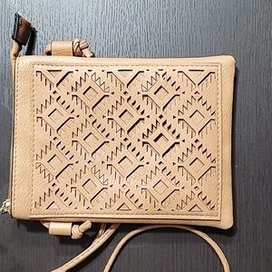 New, never used laser cut vegan Leather crossbody bag
